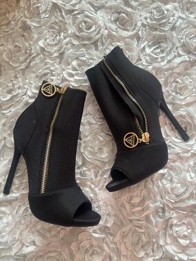 Guess Black Peep-Toe Stiletto Ankle Booties with Gold Zipper Accents
